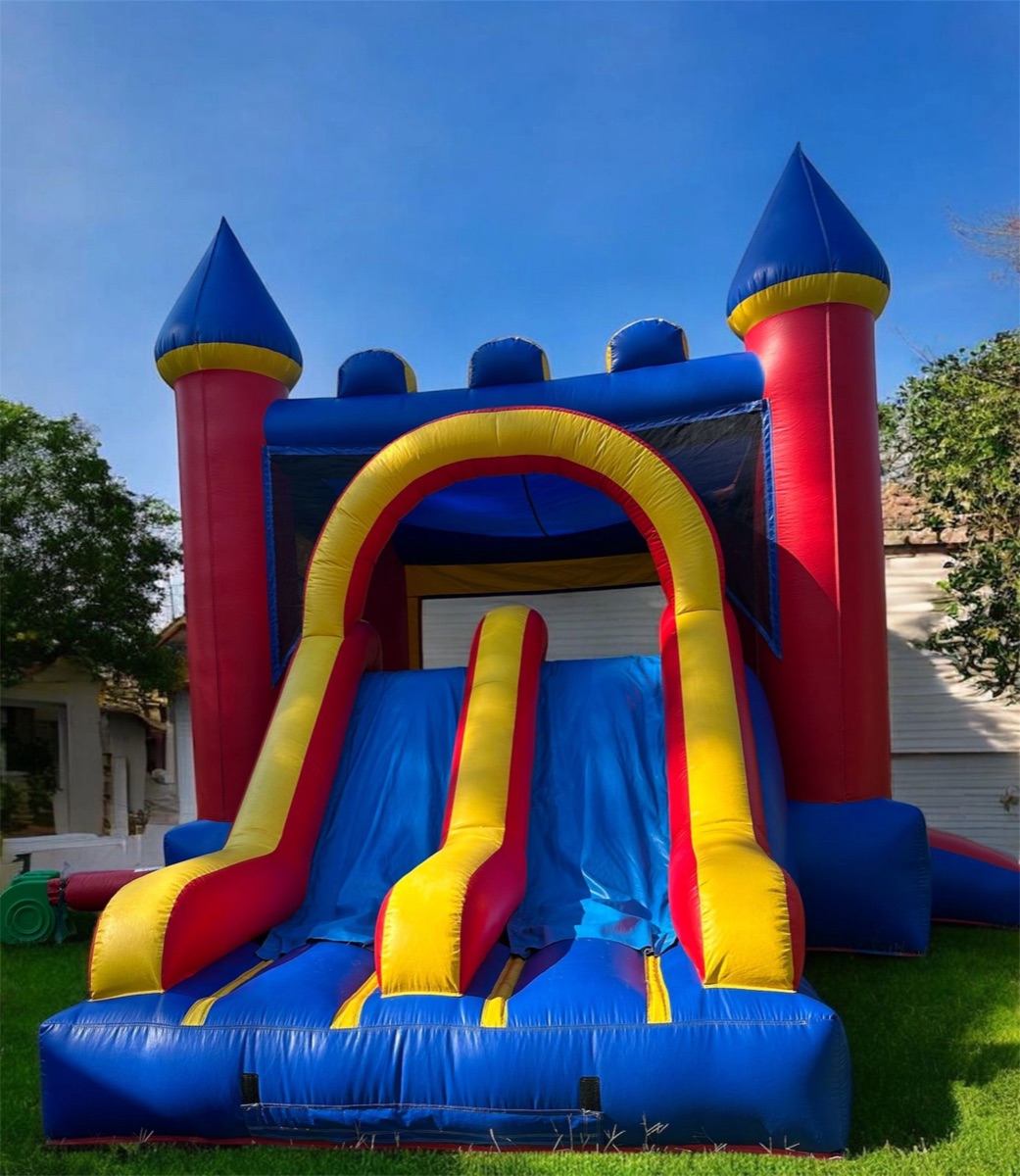 Blue and red castle bounce house with double lane slide