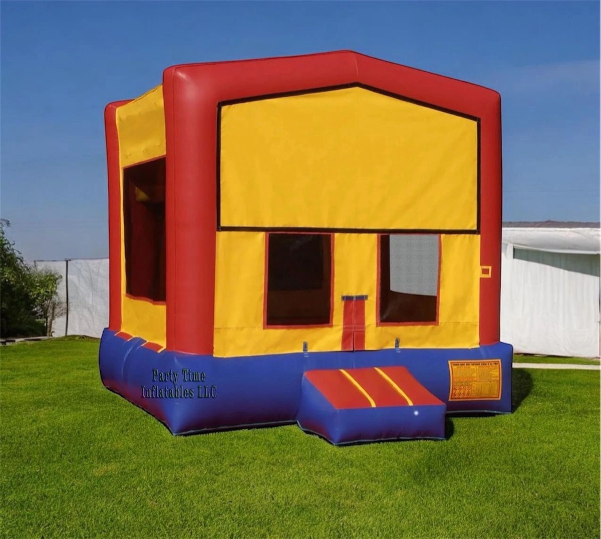 Classic red, yellow and blue 13 by 13 foot bounce house